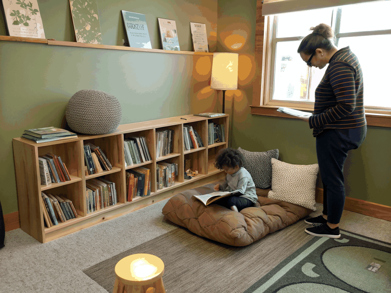 A cozy reading corner with soft cushions and books